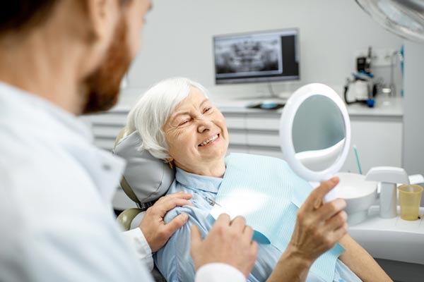 Elderly woman enjoying her new smile.
