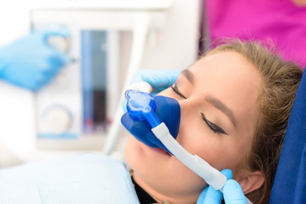 A woman utilizing sedation options at United Smile Centres in Louisville, KY