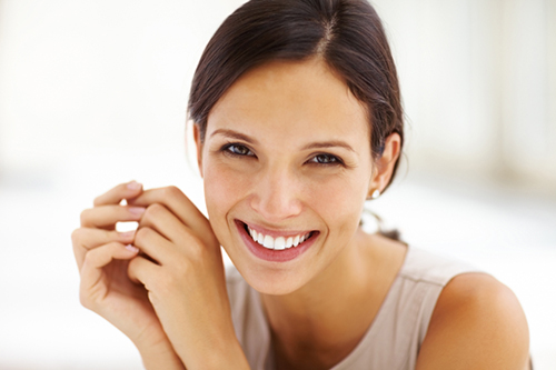 Smiling woman with healthy teeth at United Smile Centres